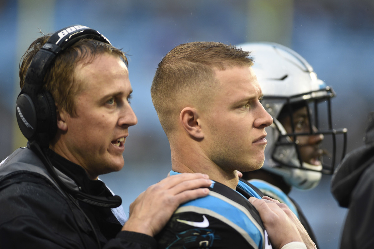 Dec 29, 2019; Charlotte, North Carolina, USA; Carolina Panthers running back Christian McCaffrey (22) with running backs coach Jake Peetz on the sidelines in the fourth quarter at Bank of America Stadium. Mandatory Credit: Bob Donnan-USA TODAY Sports